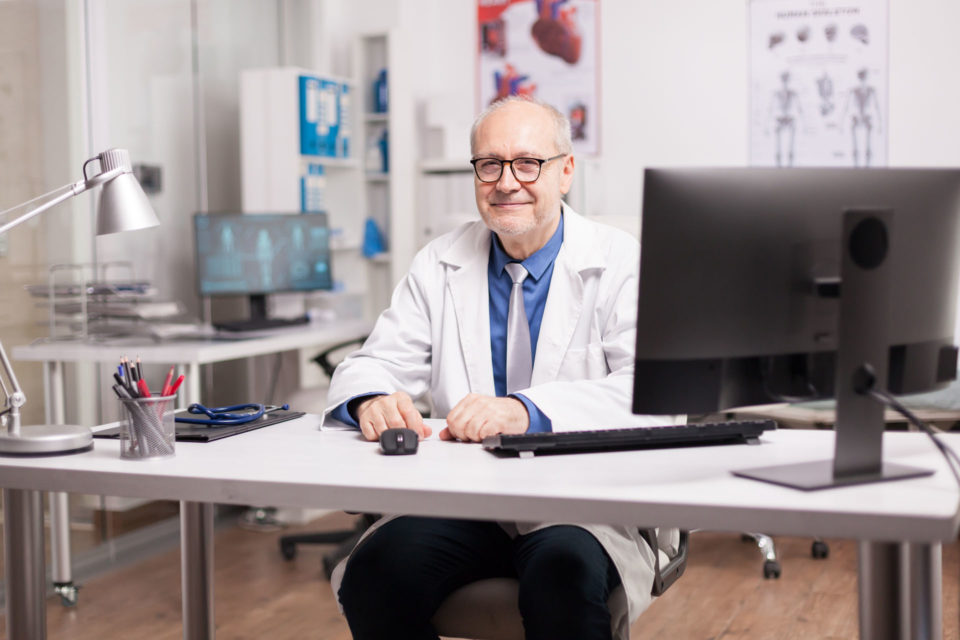 Positive elderly aged doctor elderly dentist retiring