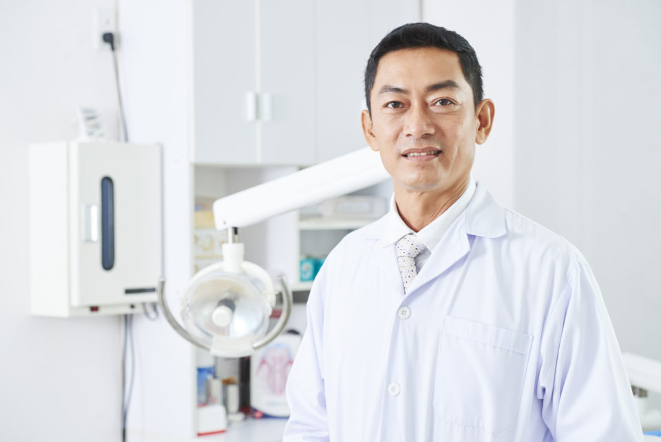Asian male dentist
