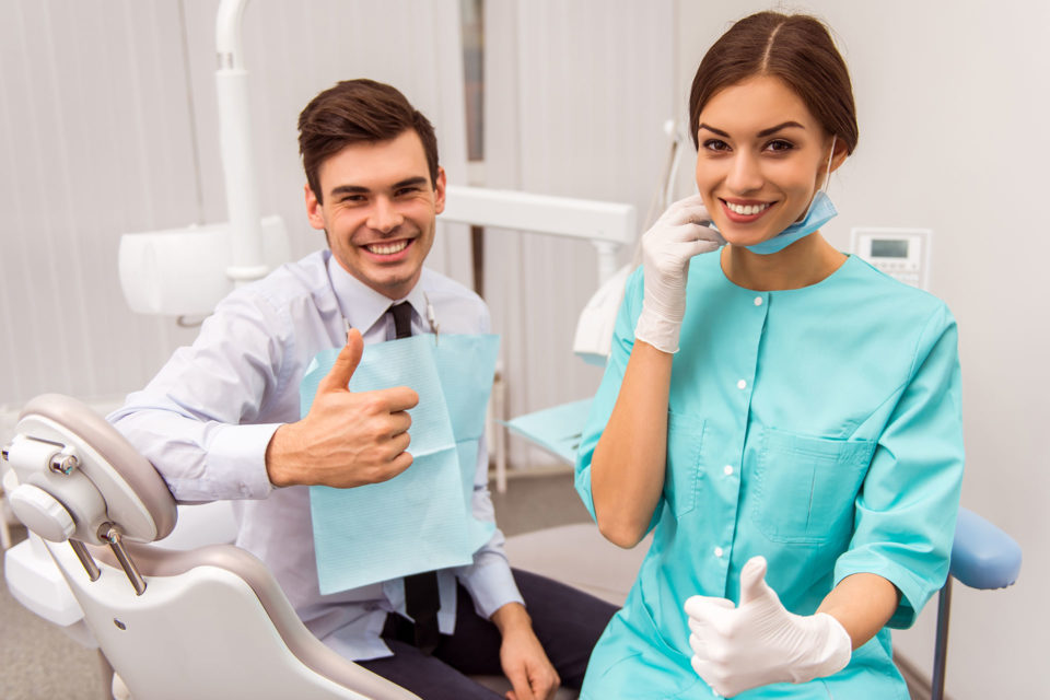 dentist and patient thumbs up