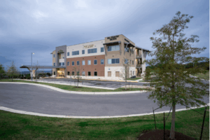 Medical office Dripping Springs exterior showing Sawyer Ranch Medical Towers with ample parking and landscaping