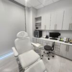 Medical office Plano TX clinical treatment room with specialized medical chair and professional healthcare equipment