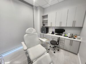 Medical office Plano TX clinical treatment room with specialized medical chair and professional healthcare equipment