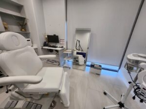 Medical office Plano TX advanced treatment room featuring medical aesthetics equipment and professional healthcare setup