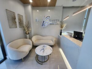 Medical office Plano TX luxury waiting area with comfortable seating and sophisticated medical spa interior design