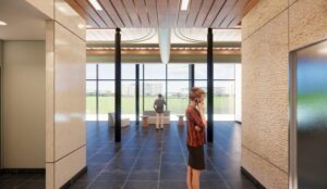 Rendering of the third-floor lobby with floor-to-ceiling windows at 7410 N Highway 161, Irving, TX