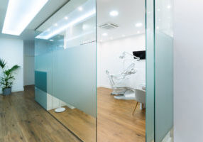 modern dentist office with frosted glass walls